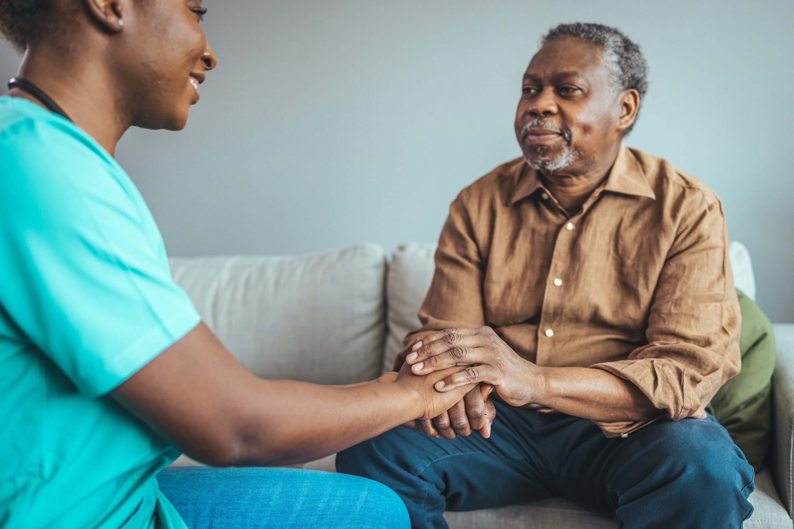 Professional care for elderly at nursing homes. Cropped shot of a female nurse hold her senior patient's hand. Close-up of home caregiver and senior woman holding hands