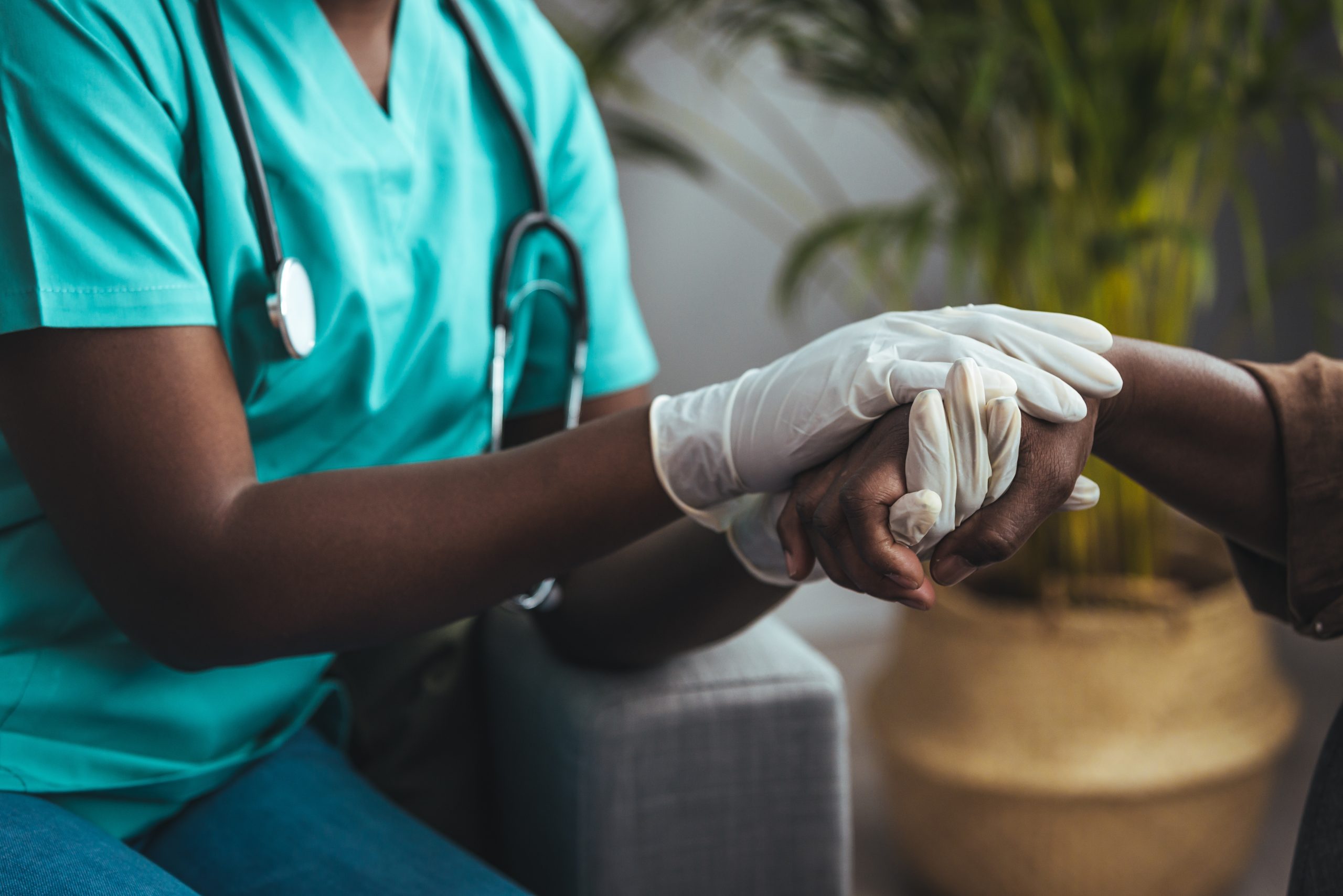 Closeup shot of a young woman holding a senior man's hands in comfort. Cropped shot of a senior man and a nurse holding hands. Not just a caregiver but a confidant