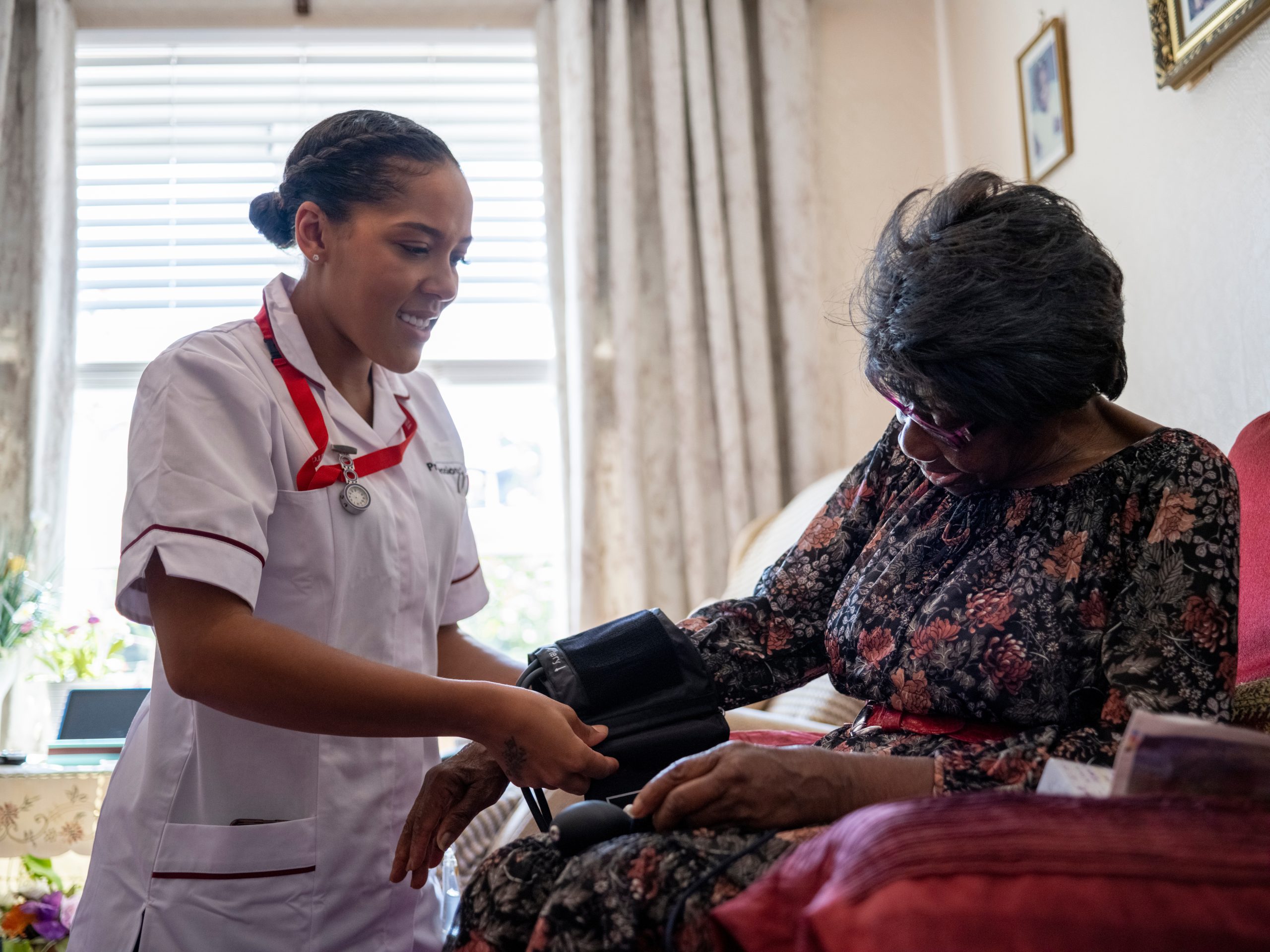 Nurse�taking care of elderly woman, measuring blood pressure